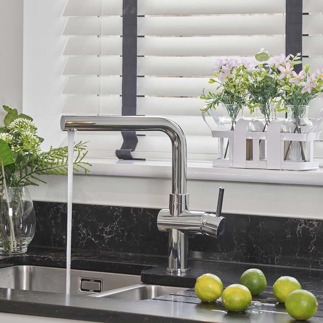 Kitchen image of a tap with running water