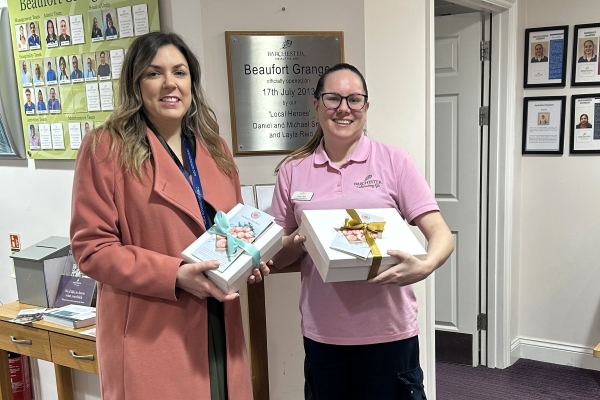 Crest Nicholson staff delivering cupcakes to staff at a care home